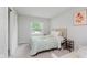 Cozy bedroom with a comfortable bed, a window view, and a closet at 7606 Old Oakland Blvd E Dr, Indianapolis, IN 46236