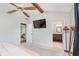 Bright main bedroom with a ceiling fan and an attached bathroom at 7606 Old Oakland Blvd E Dr, Indianapolis, IN 46236
