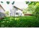 Spacious backyard featuring a well-maintained lawn and partial privacy fence at 7611 Misty Meadow Dr, Indianapolis, IN 46217