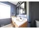 Bathroom features a double sink vanity, large mirrors, and modern lighting fixtures at 7611 Misty Meadow Dr, Indianapolis, IN 46217
