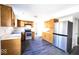 This kitchen features modern appliances, wood cabinets, and plenty of counter space at 7611 Misty Meadow Dr, Indianapolis, IN 46217