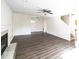 This living room features fresh paint, wood-look flooring and a fireplace at 7611 Misty Meadow Dr, Indianapolis, IN 46217