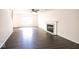 Bright living room featuring a fireplace, wood-look flooring and neutral paint at 7611 Misty Meadow Dr, Indianapolis, IN 46217