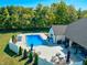 Gorgeous aerial view of the property featuring a pool, patio, beautiful landscaping, and lush trees at 8112 Joni Ave, Martinsville, IN 46151