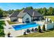 Aerial view of a stunning home with a pool, patio, lounge chairs, landscaping, and lush green surroundings at 8112 Joni Ave, Martinsville, IN 46151