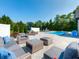 Beautiful backyard retreat featuring a sparkling swimming pool and comfortable lounge seating at 8112 Joni Ave, Martinsville, IN 46151