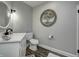 Bathroom with vanity, mirror, toilet and modern lighting and decor at 8112 Joni Ave, Martinsville, IN 46151