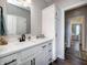 Bathroom features a stylish vanity with modern fixtures, storage, and a glimpse of the adjacent bedroom at 8112 Joni Ave, Martinsville, IN 46151