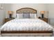 Inviting bedroom showcasing a tufted headboard, decorative pillows, and matching bedside tables with lamps at 8112 Joni Ave, Martinsville, IN 46151