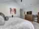 Spacious bedroom features a wooden dresser, television, and a stylish painting, creating a relaxing atmosphere at 8112 Joni Ave, Martinsville, IN 46151