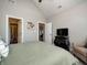 Comfortable bedroom with a black dresser and a comfy armchair with a throw pillow at 8112 Joni Ave, Martinsville, IN 46151