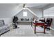 Bonus room featuring vaulted ceilings, neutral carpet, ceiling fan and bright windows at 8112 Joni Ave, Martinsville, IN 46151