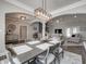 Bright dining room with hardwood floors, statement lighting, and open-concept design to other rooms at 8112 Joni Ave, Martinsville, IN 46151