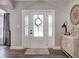 Entryway featuring a white door with glass inserts and decorative accents against a neutral color scheme at 8112 Joni Ave, Martinsville, IN 46151
