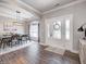 Elegant foyer with wood floors, chandelier lighting, and dining room visible through open archway at 8112 Joni Ave, Martinsville, IN 46151
