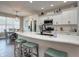 Modern white kitchen with stainless steel appliances, kitchen island with seating, and sleek countertops at 8112 Joni Ave, Martinsville, IN 46151
