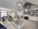 Spacious living room with vaulted ceilings, fireplace, comfortable seating, and open access to the dining area at 8112 Joni Ave, Martinsville, IN 46151