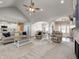 Spacious living room featuring vaulted ceiling, neutral colors, fireplace and open concept at 8112 Joni Ave, Martinsville, IN 46151