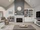 Cozy living room with high ceilings, stone fireplace, built-in shelving, and neutral color scheme for a relaxing ambiance at 8112 Joni Ave, Martinsville, IN 46151