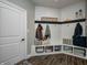 Stylish mudroom featuring white shiplap walls, hooks, bench seating, and storage shelves at 8112 Joni Ave, Martinsville, IN 46151