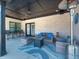 Relaxing outdoor patio with comfortable seating, ceiling fan, gas fireplace, and outdoor decor at 8112 Joni Ave, Martinsville, IN 46151