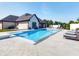 Backyard features a sparkling pool, patio, lounge chairs, and a well-maintained home exterior at 8112 Joni Ave, Martinsville, IN 46151