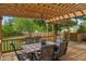 Outdoor dining on the back deck under a charming pergola with string lights at 828 Breaside Ln, Greenwood, IN 46143