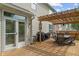 Enjoy outdoor living with this back deck featuring a pergola and seating area at 828 Breaside Ln, Greenwood, IN 46143