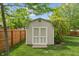 Backyard shed is perfect for storing tools and garden equipment at 828 Breaside Ln, Greenwood, IN 46143