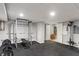 Finished basement workout area with weightlifting rack and rubber flooring at 828 Breaside Ln, Greenwood, IN 46143
