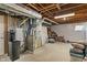 Unfinished basement area featuring a water heater, HVAC, and storage space at 828 Breaside Ln, Greenwood, IN 46143