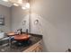 Bathroom featuring granite countertop, vessel sink, modern faucet, and ample vanity storage space at 828 Breaside Ln, Greenwood, IN 46143