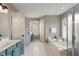 The spacious bathroom includes a soaking tub, shower, double sinks, and a linen closet at 828 Breaside Ln, Greenwood, IN 46143