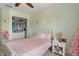 Charming bedroom with closet and dresser storage featuring plush carpet and pink decorations at 828 Breaside Ln, Greenwood, IN 46143