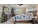 A well-lit bedroom with ceiling fan, windows, and nice furnishings at 828 Breaside Ln, Greenwood, IN 46143