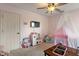 Pink themed room featuring a ceiling fan, carpeted floor, toys, and play kitchen at 828 Breaside Ln, Greenwood, IN 46143