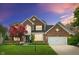 Charming two-story brick home with a well-manicured lawn and attached two car garage at 828 Breaside Ln, Greenwood, IN 46143