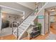 Welcoming foyer with hardwood floors and staircase leading to the upper level at 828 Breaside Ln, Greenwood, IN 46143