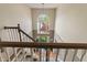 Bright foyer featuring a large window, hardwood floors, and staircase leading to upper level at 828 Breaside Ln, Greenwood, IN 46143