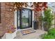 Inviting front entrance with a decorative door, seasonal plants, and a welcome mat at 828 Breaside Ln, Greenwood, IN 46143