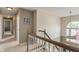 Second floor hallway with hardwood floors and natural light from the foyer window at 828 Breaside Ln, Greenwood, IN 46143