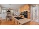 Open-concept kitchen showcasing granite countertops, wood cabinets, and stainless steel appliances at 828 Breaside Ln, Greenwood, IN 46143