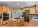 Well-designed kitchen with stainless steel appliances, wood cabinetry, and granite countertops on island at 828 Breaside Ln, Greenwood, IN 46143