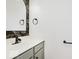 Stylish powder room with a modern sink and vanity featuring black and gold wallpaper at 8300 Weaver Woods Pl, Fishers, IN 46038