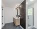 This bathroom features a double sink vanity, modern fixtures, and a spacious glass enclosed shower at 8300 Weaver Woods Pl, Fishers, IN 46038