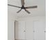 This bedroom has carpet, an updated ceiling fan, and closet with sliding doors at 8300 Weaver Woods Pl, Fishers, IN 46038