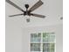 This bright bedroom features a contemporary ceiling fan and a large window at 8300 Weaver Woods Pl, Fishers, IN 46038
