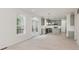 Spacious open kitchen and living area with sage green cabinets and a deck at 8300 Weaver Woods Pl, Fishers, IN 46038