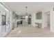 Open concept kitchen with gray cabinets, a center island, and stainless steel appliances at 8300 Weaver Woods Pl, Fishers, IN 46038