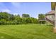 Large, well-maintained backyard with ample green space and a back deck area for outdoor entertaining at 888 Westcreek Dr, Columbus, IN 47201